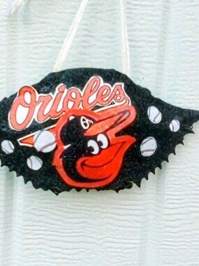 Oriole's Bird Ornament Crabshell Adorned Black & Orange Glitter.